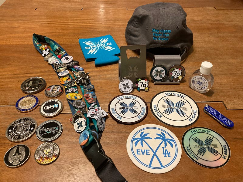 Assortment of badges, coins, and morale pins.